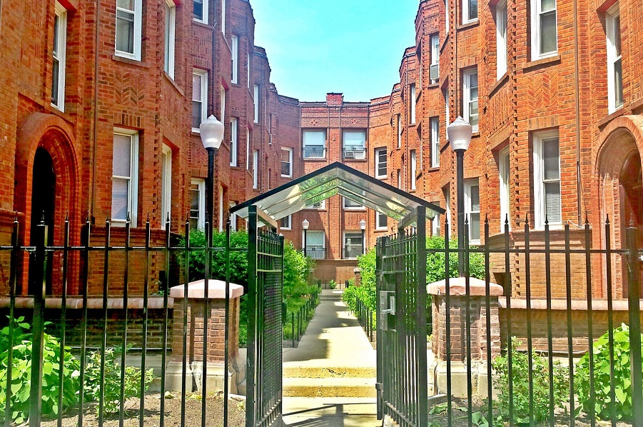 Stunning brick exterior with lovely courtyard
