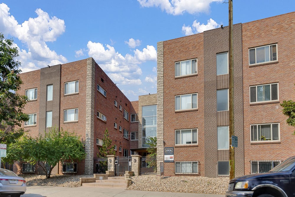 Come home to 1335 E Pearl Come home to 1335 E Pearl, the exterior of the property is featured here with tall modern buildings at 1355 Pearl in Denver, CO