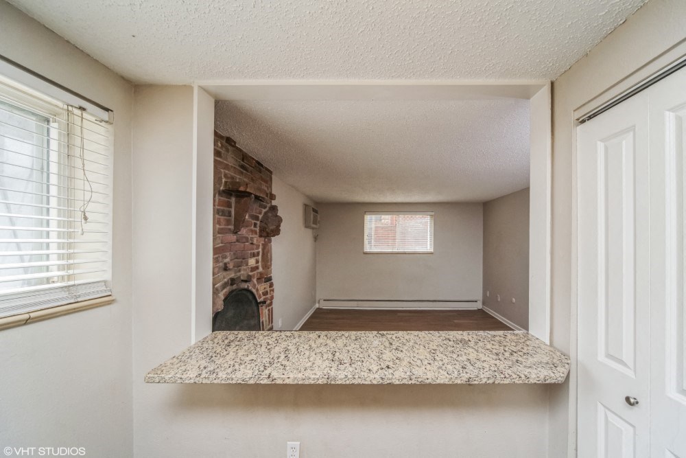 Kitchen with a breakfast bar overlooking the living room