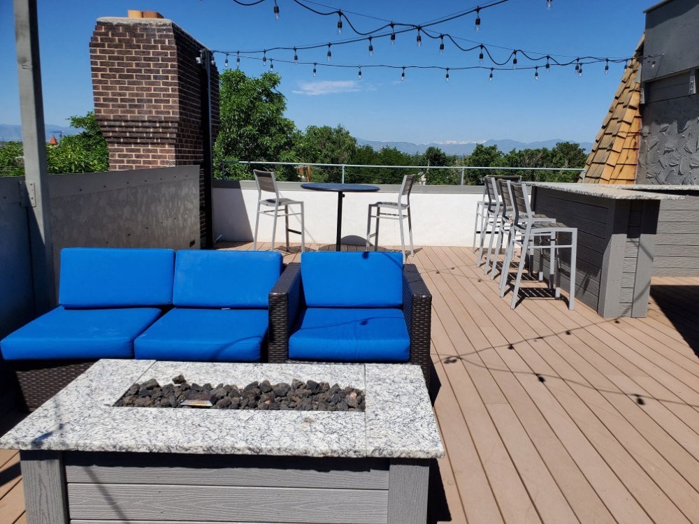 Beautifully upgraded rooftop patio with cornhole and grills
