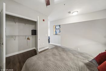 a bedroom with a large bed and a closet