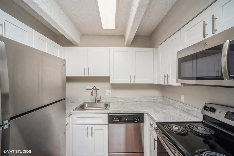 Upscale kitchen with stainless steel appliances at 878 S Dexter St in Denver, CO