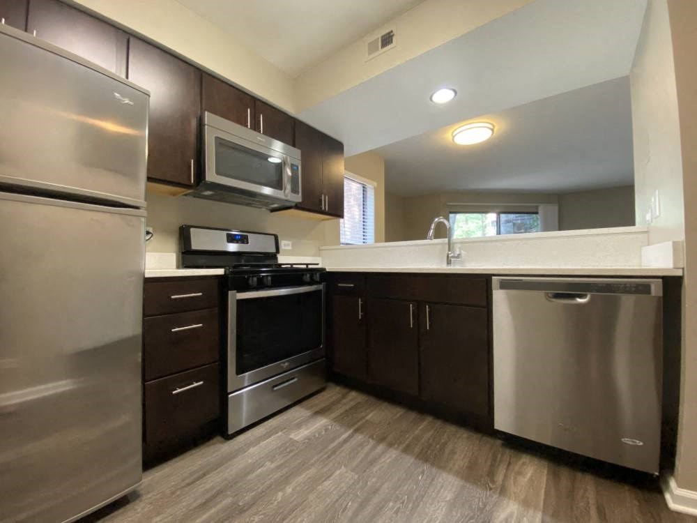 Upgraded kitchen with rich wood cabinetry