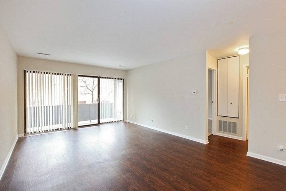 Living room with private patio or balcony access