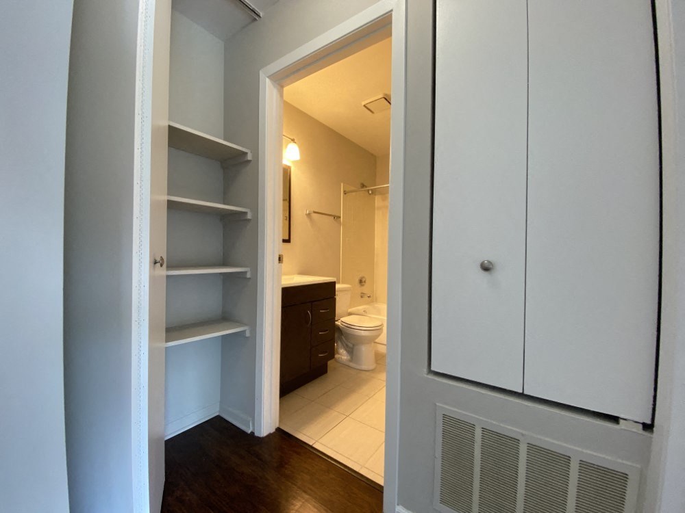 Conveniently located bathroom with linen closet