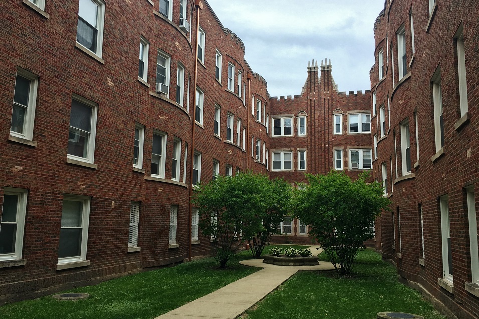 Historic brick exterior with a lovely courtyard