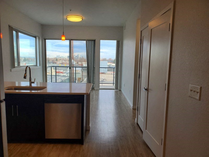 Lovely open living area with an amazing view at Wash Park Station in Denver, CO