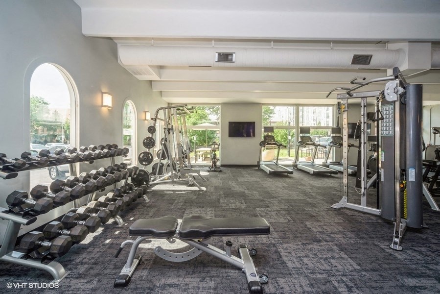 Fitness center with free weights at 878 S Dexter St in Denver, CO