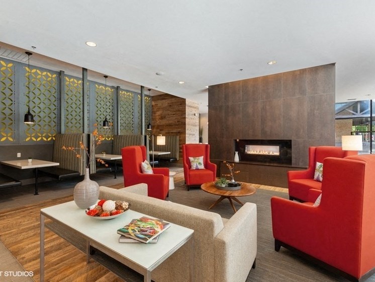 Modern Common Area with an Indoor Fireplace and Comfortable Seating