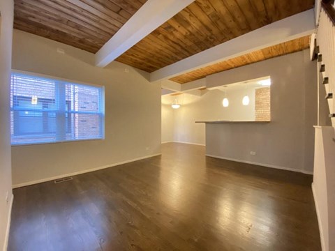 Beautiful living room with rich wood flooring and high ceilings