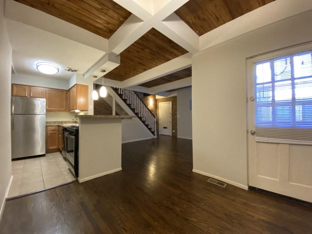 Open living area with kitchen and living room on entry floor