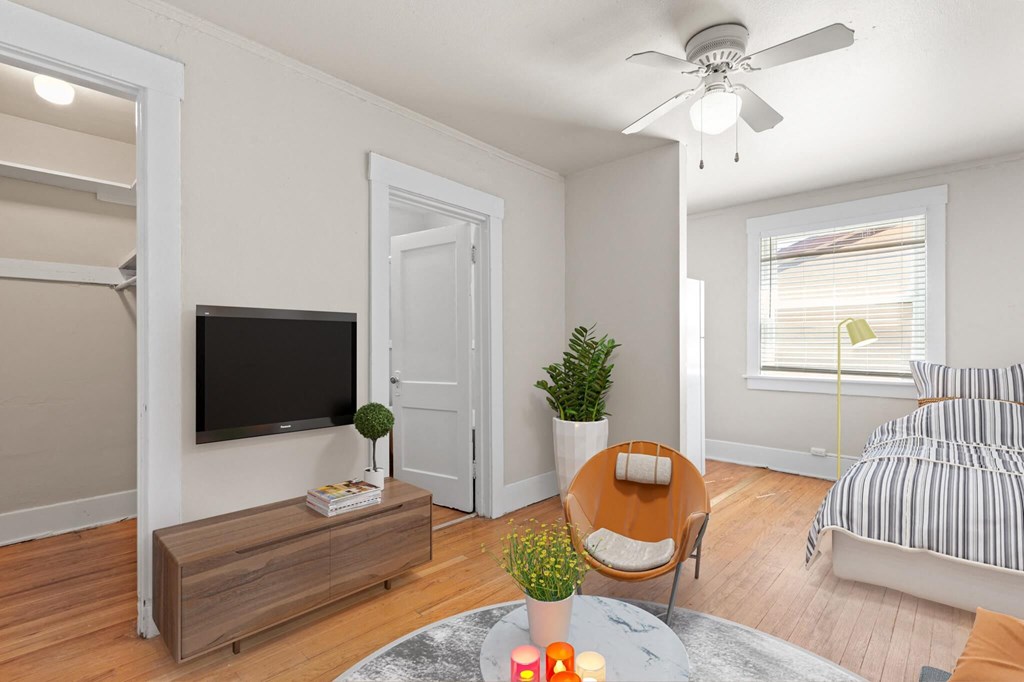 a living room with a couch and a tv