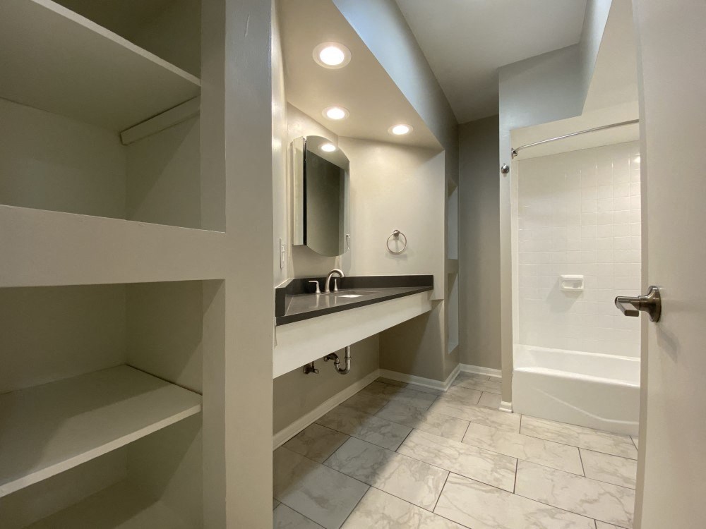 Bathroom with large linen closet