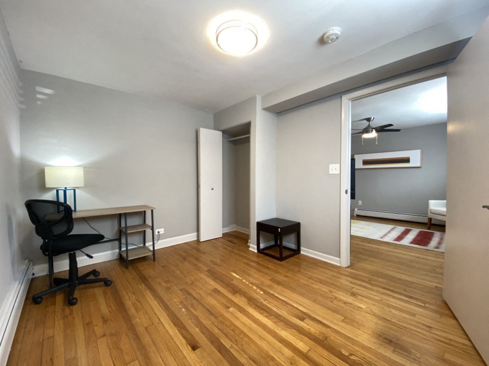 Bedroom with a closet and hardwood flooring