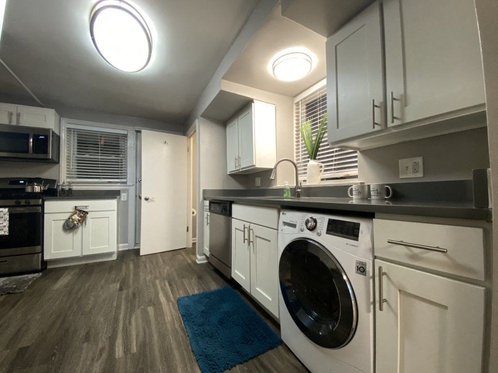 Kitchen with washer/dryer combo and stainless steel appliances