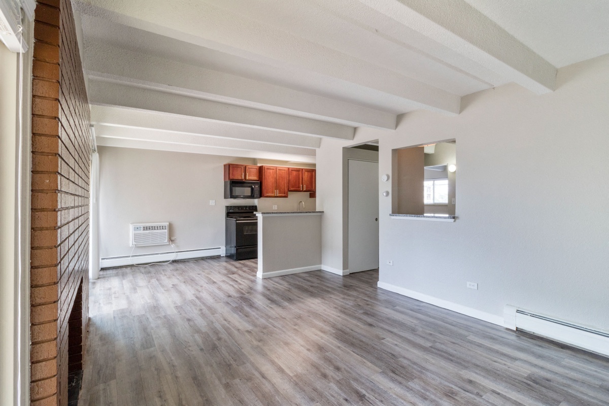 Bright living space with a fireplace and hardwood floors