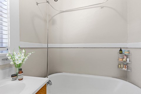 Classic charm meets modern simplicity in this serene bathroom 1170 N Logan St in Denver, CO