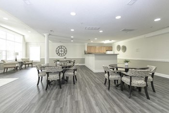 Open and airy community room with plenty of seating Property Image