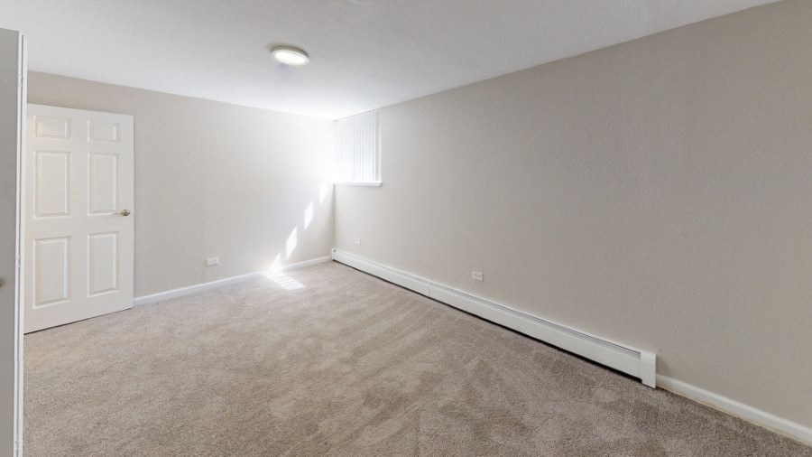 Carpeted bedroom at 4805 E Kentucky in Denver, CO