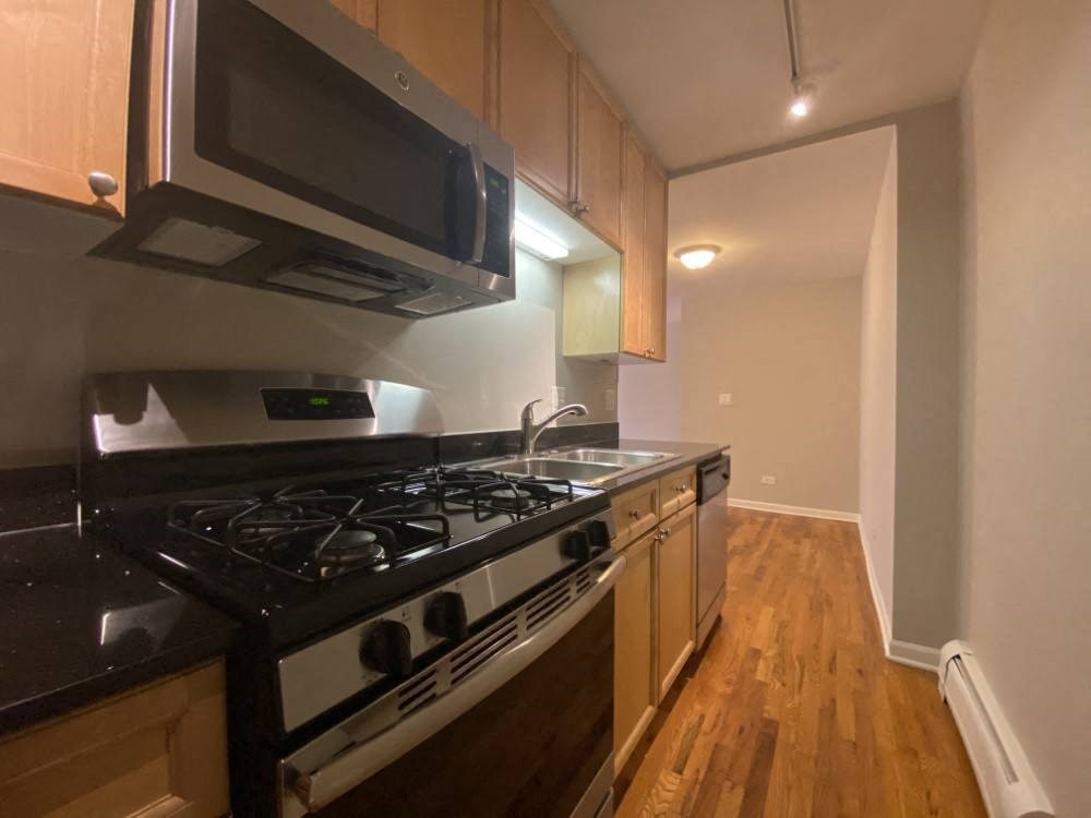 Stainless steel appliances with a built in microwave - Large One Bedroom