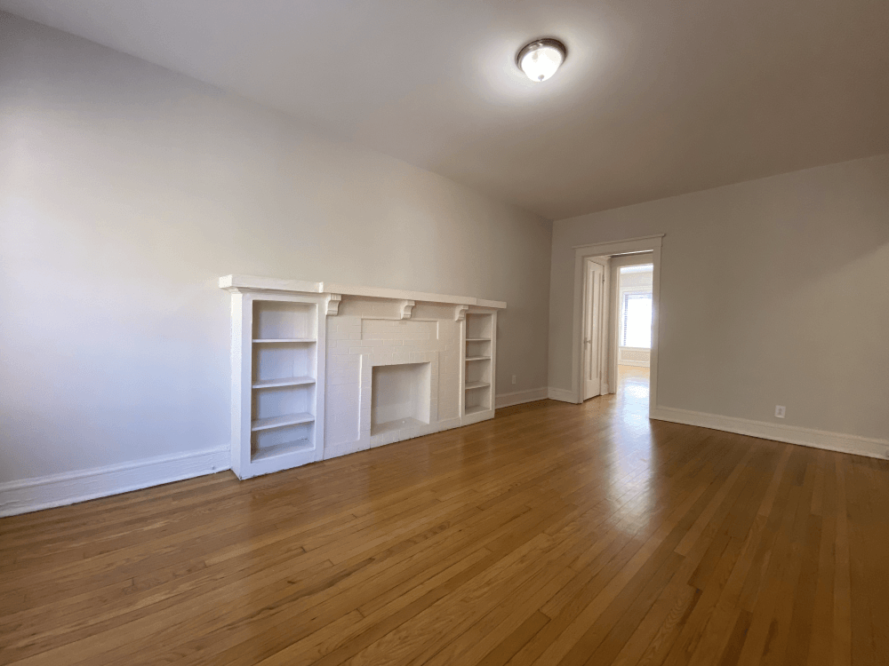 Hardwood flooring and decorative fireplace