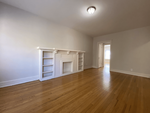 Hardwood flooring and decorative fireplace