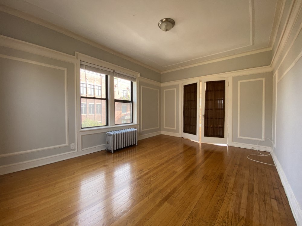 Bedroom with French doors and stunning hardwood floors