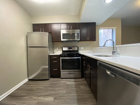 a kitchen with stainless steel appliances and a sink
