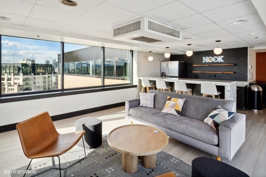 a lounge area with a couch and a coffee table