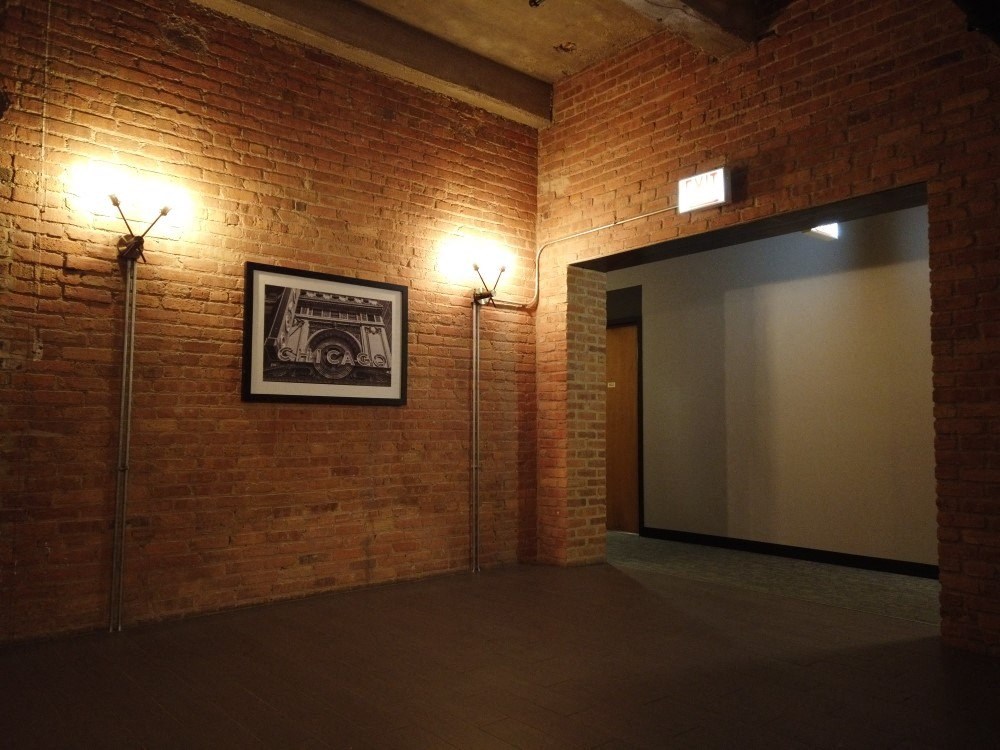 Exposed bring walls in the common area hallwaysat Carriage House Lofts, Chicago, Illinois