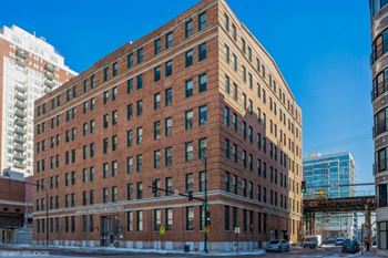 a tall brick building on a city street