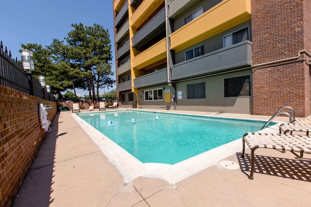 A pool in a courtyard surrounded by buildings at 878 S Dexter St in Denver, CO