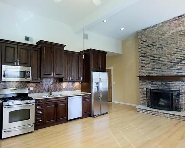 Exposed Brick Fireplace