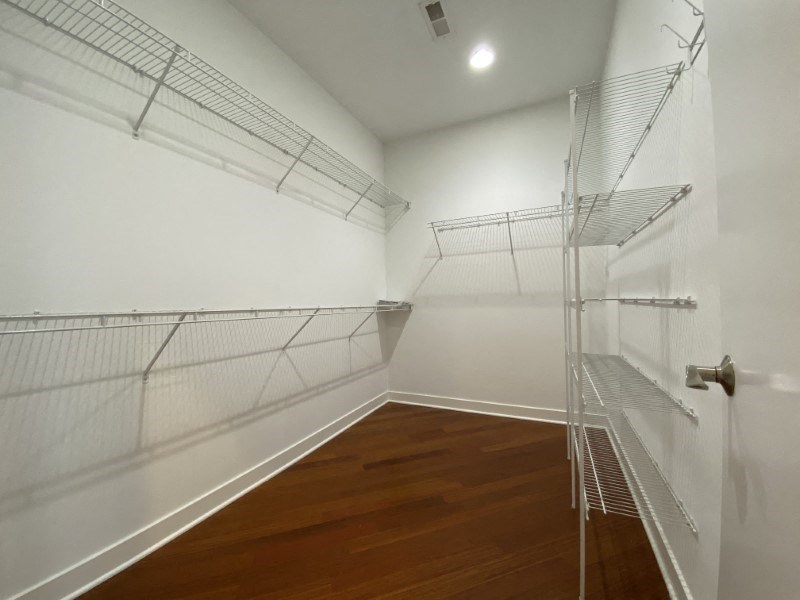Large walk-in closet with built-in shelving