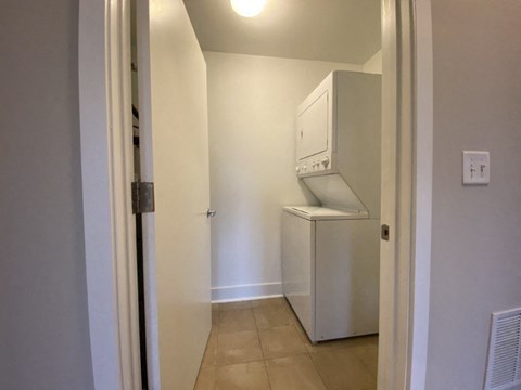 a kitchen with a refrigerator and a washing machine