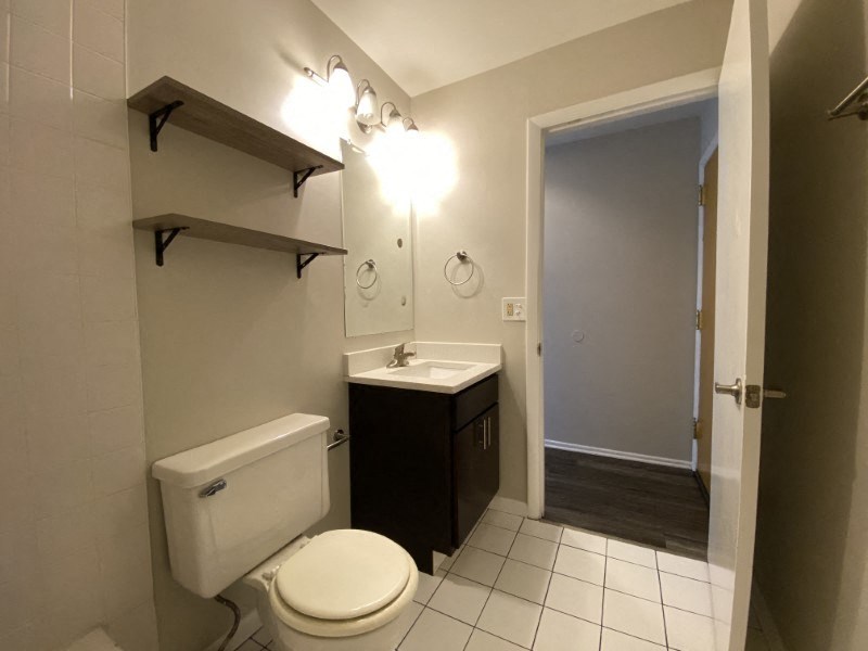 Bathroom with storage shelves