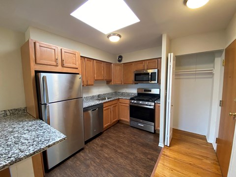 a kitchen with stainless steel appliances and granite counters