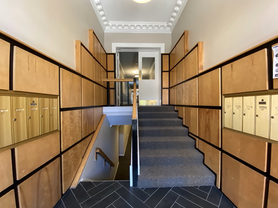 A staircase with wooden steps and railings.