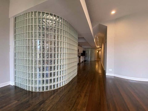a large glass wall in the middle of a living room