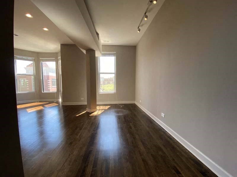 Hardwood floors and large windows