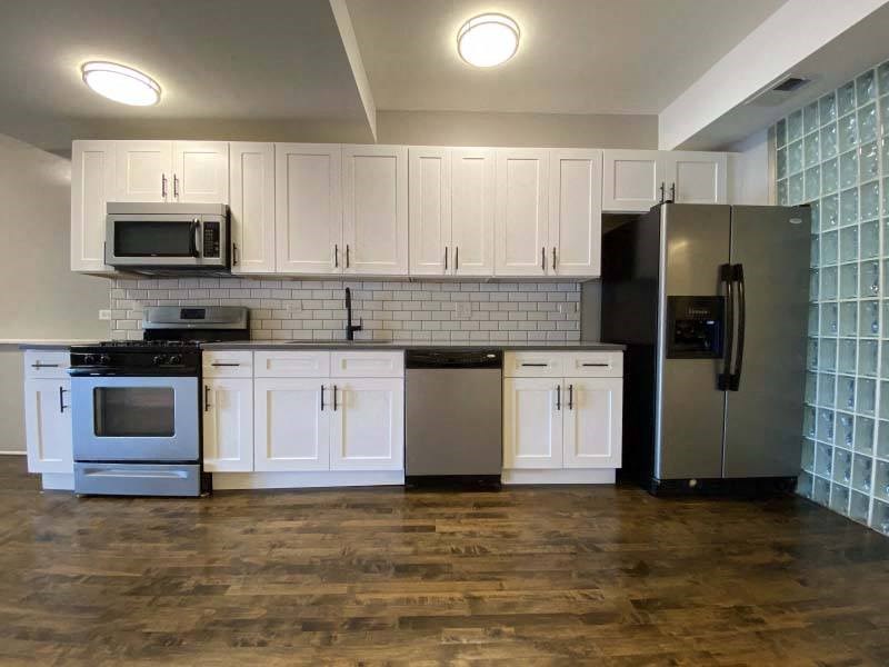 Large kitchen with hardwood floors