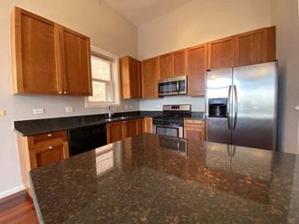 Stunning granite countertops in the large kitchen space