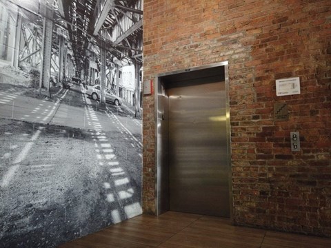 Fun mural on wall by the elevator at Carriage House Lofts, Chicago, 60605