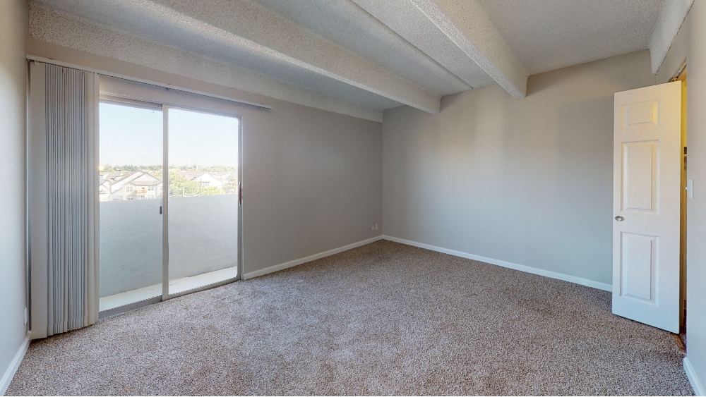 Large bedroom with balcony access