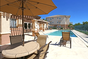 Pool area with plenty of tables and umbrellas Pool area with plenty of tables and umbrellas - Photo Gallery 2