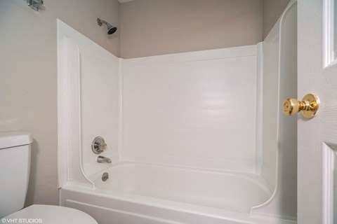 Bright bathroom with tub at The Helix in Denver, CO