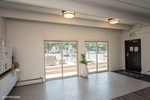 Large windows in the spacious clubhouse at 1140–1160 S Bellaire St in Denver, CO
