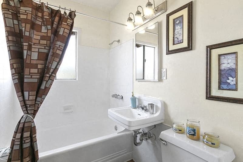 a bathroom with a sink and a bath tub