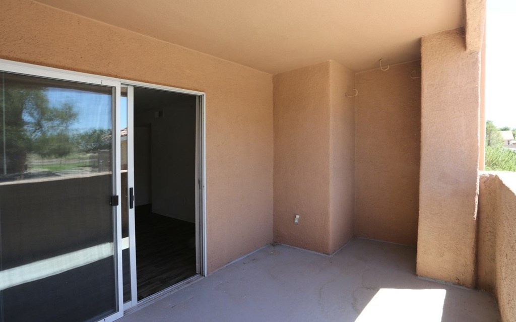 Private patio with a sliding glass door at Canon de Arrowhead in Albuquerque, New Mexico
