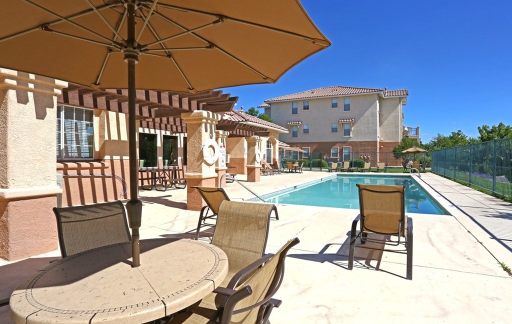 Lovely pool deck with seating at Canon de Arrowhead in Albuquerque, New Mexico